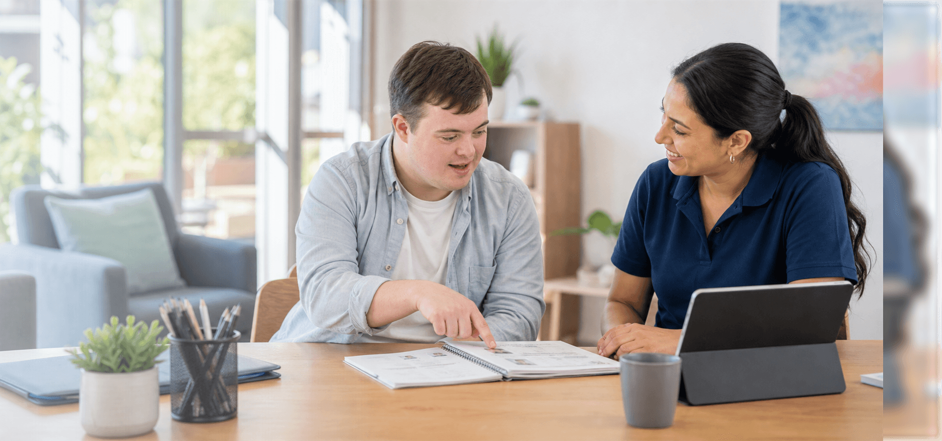 NDIS participant and support worker planning community goals together