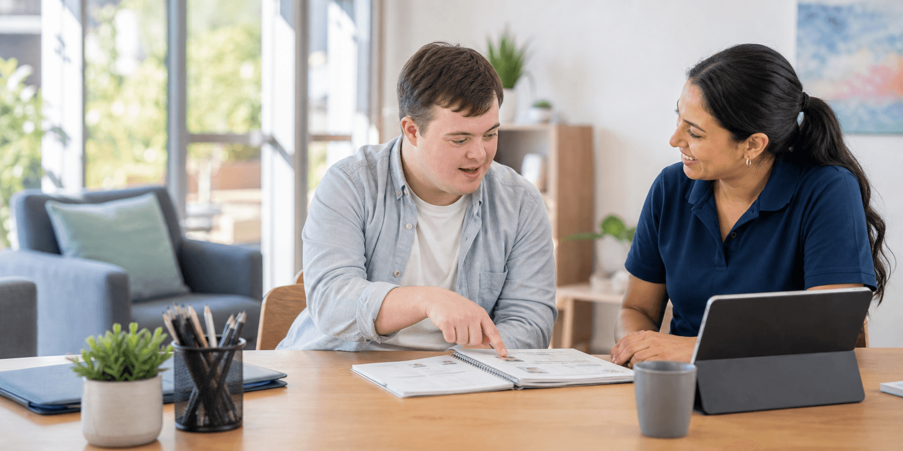 NDIS participant and support worker planning community goals together